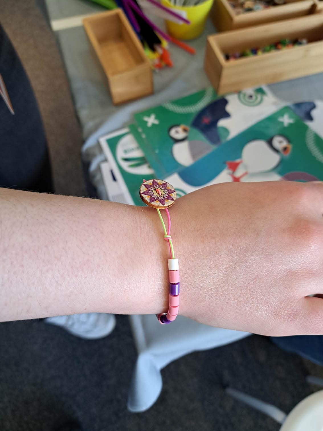 Child's wrist with bead bracelet