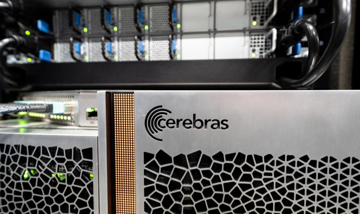 Cerebras CS-2 system. Image shows logo engraved onto steel panel and dark embossed geometric design.