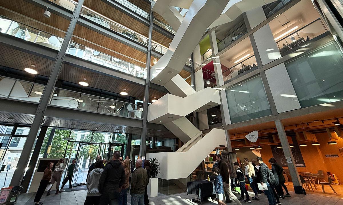 Internal view of Bayes Centre with some people on ground floor.