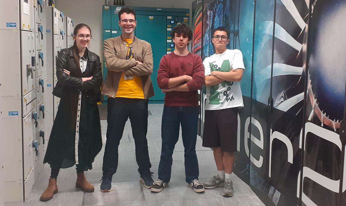 4 HPC Summer School students beside ARCHER2