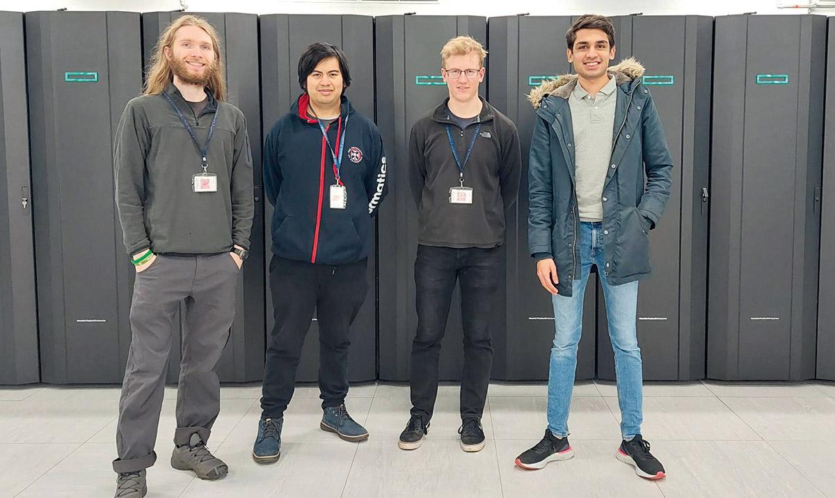 4 students in front of an HPC system