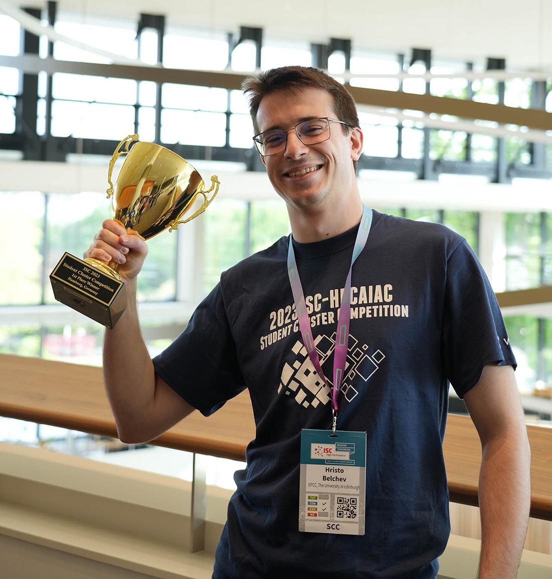 Young man with trophy cup