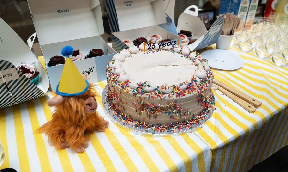 EPCC mascot Highland Cow toy with birthday cake