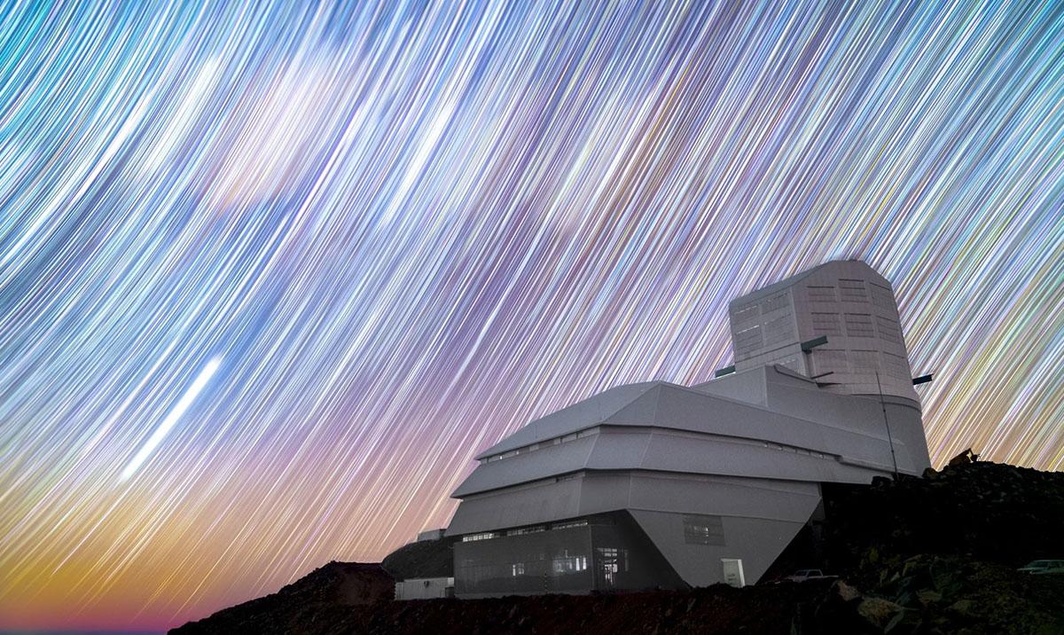 Rubin Observatory stands on Cerro Pachón in Chile against a sky full of star trails in this long exposure night sky image. Credit: Hernan Stockebrand