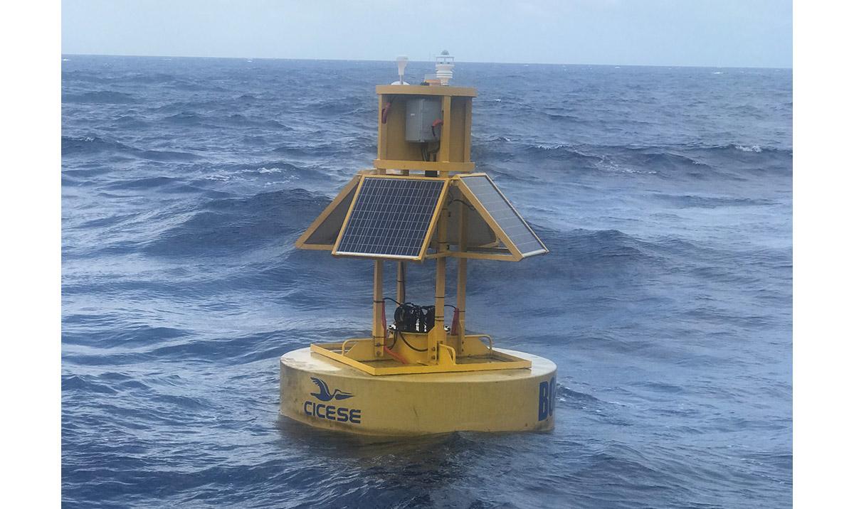 A large yellow buoy at sea