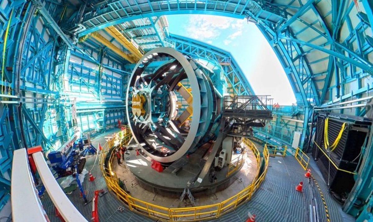 Wide angle image of large telescope under construction.
