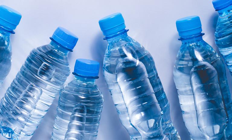 plastic water bottles against white background