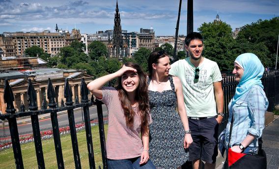 4 students on the Mound in Edinburgh in summertime