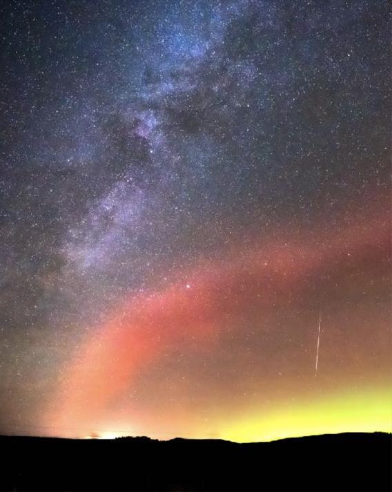 Image of the Milky Way, a meteor and the Northern Lights, seen from Tomintoul.