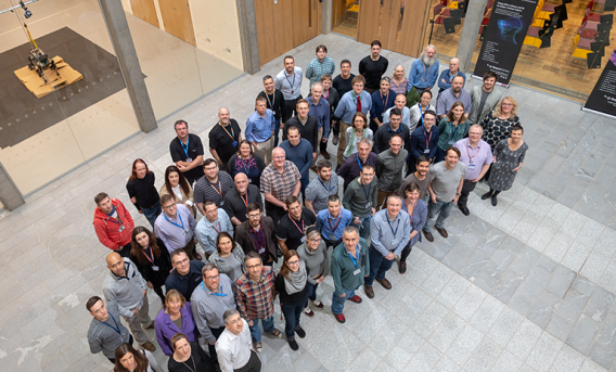 Group of people looking upwards in an atrium